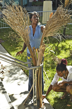 photo of two women working on nature sculptures 