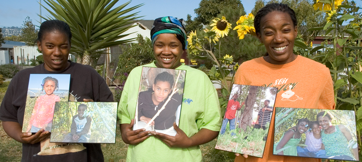 photo of mothers with mounted photos of children