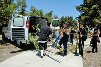students helping load van